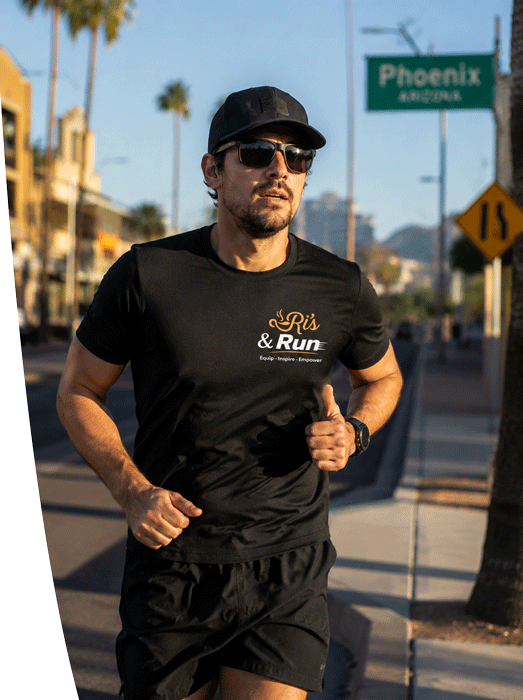 Runners on a desert road wearing Ri's & Run event t-shirts
